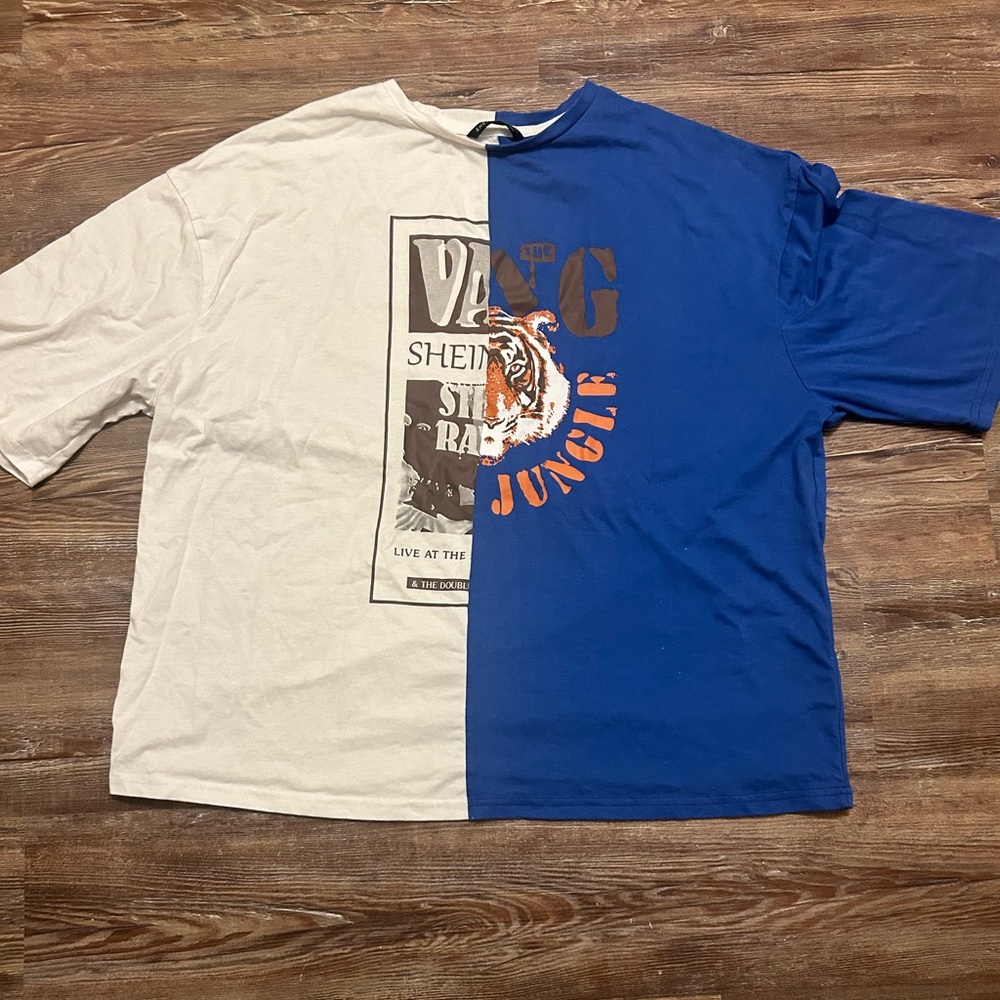 Half white half blue graphic tee. Was only worn once.